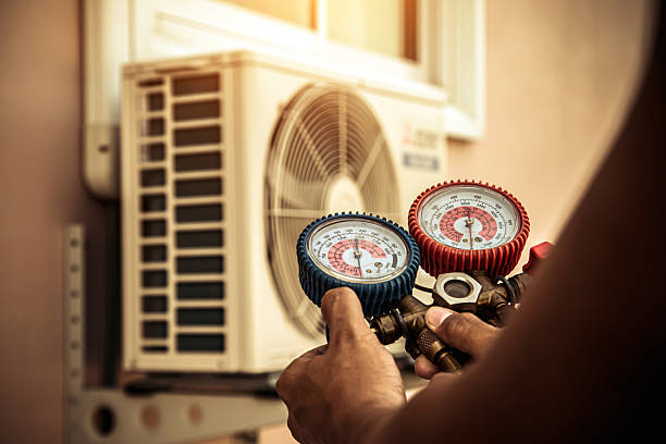 Professional Air Conditioning Service technician working in Cherry Valley, IL